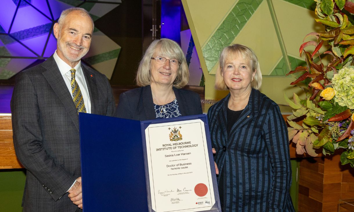 Kathy Daniels (centre) accepting the posthumous Honorary Doctorate of Business on behalf of Saskia Loer Hansen with Alec Cameron (left) and Peggy O'Neal (right).