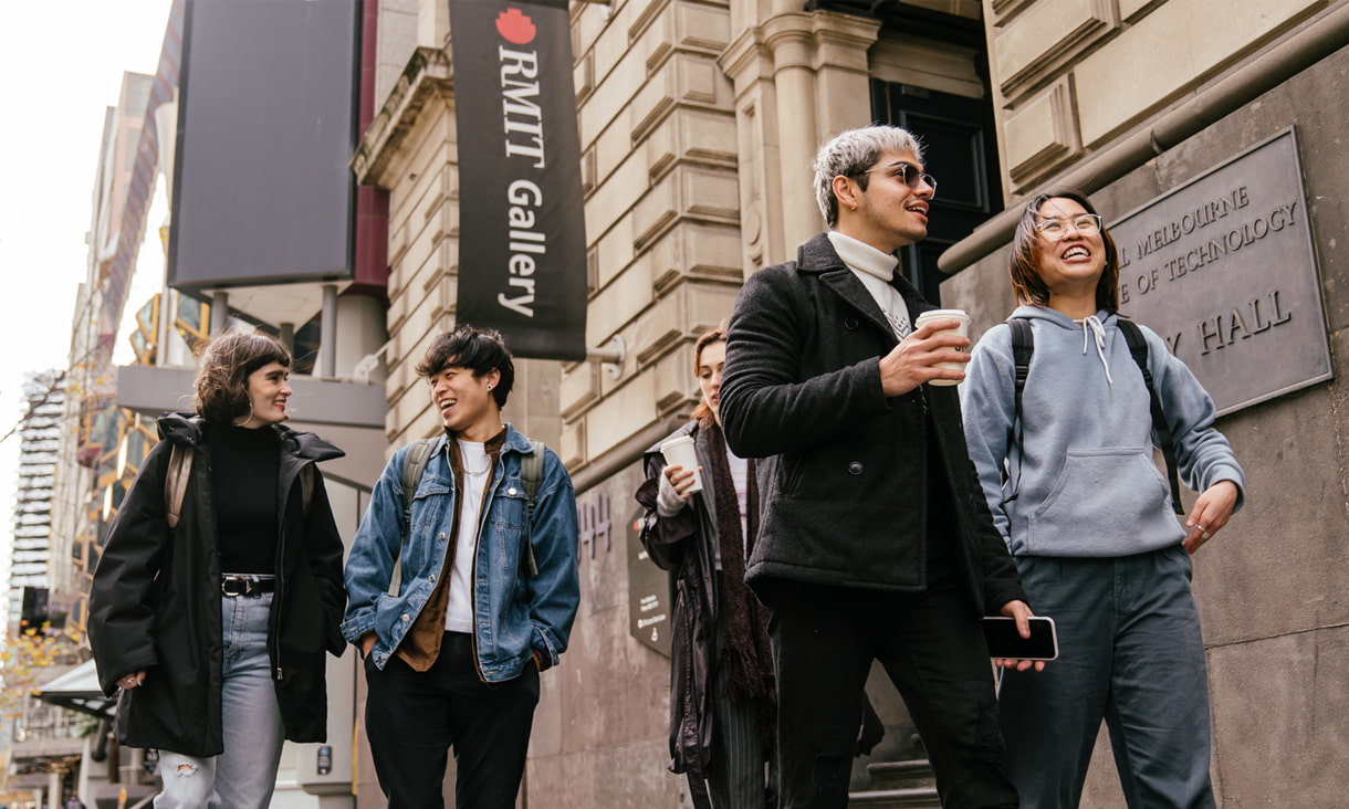 Five RMIT students walking down Swanston Street, Melbourne