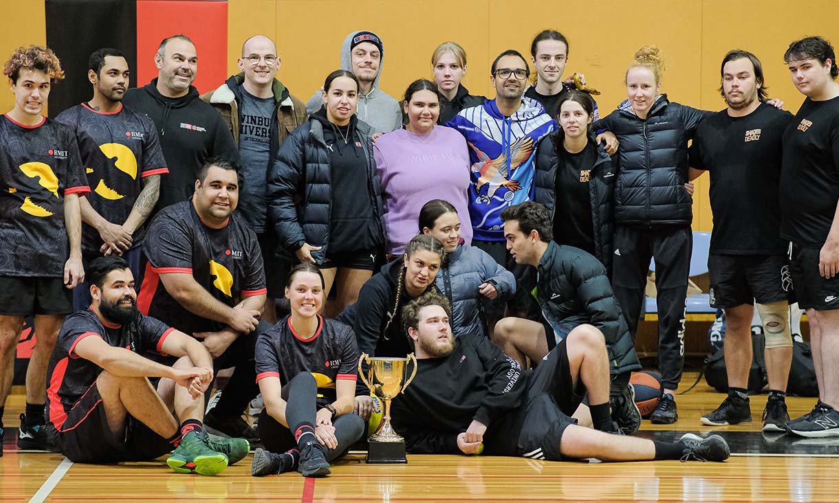 Indigenous students in a team photo celebrating their trophy win