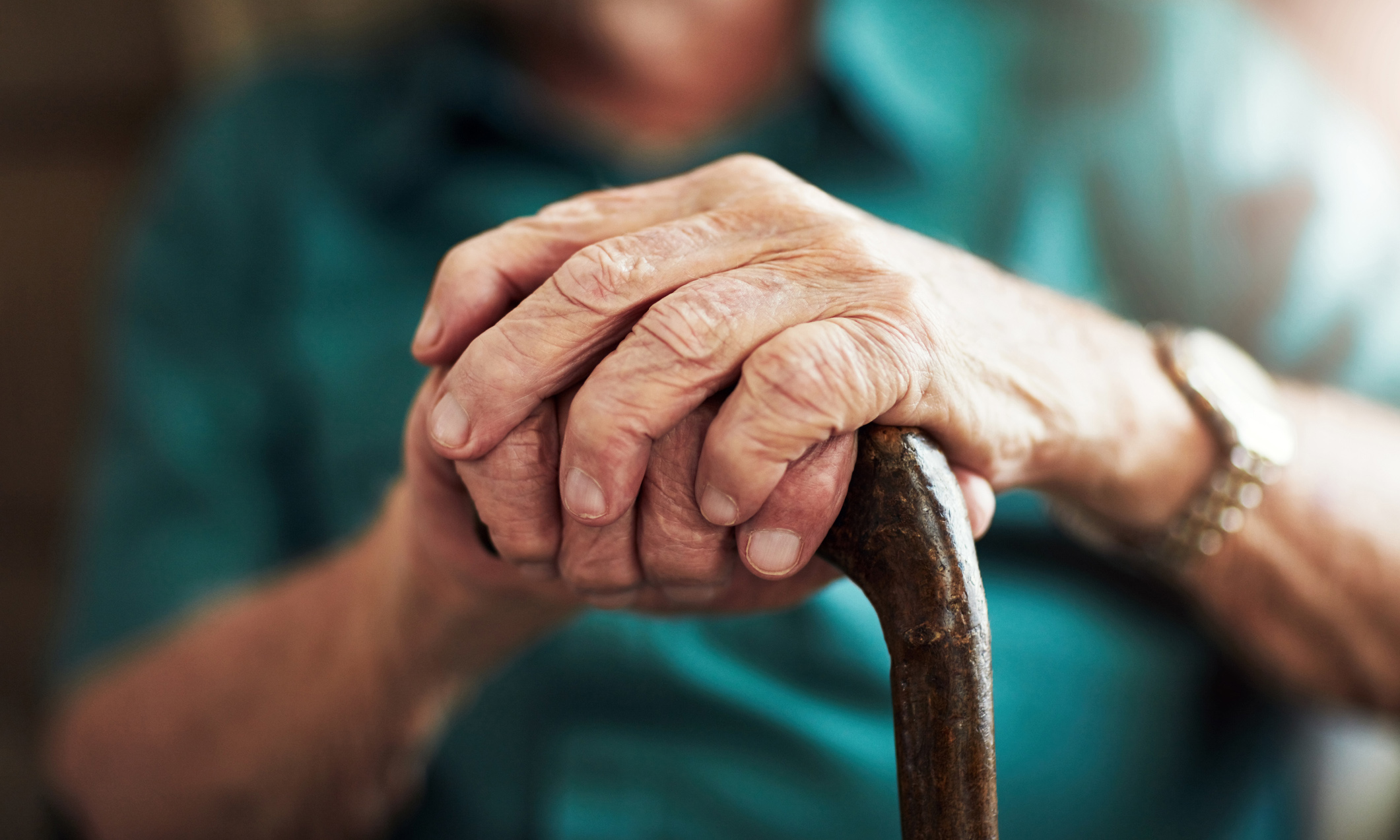 news-elderly-hands-cane.jpg