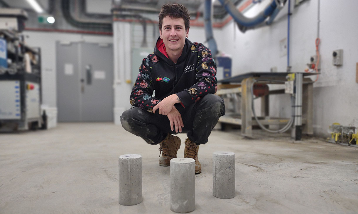 Vice-Chancellor’s Indigenous Pre-Doctoral Fellow at RMIT and co-researcher Shannon Kilmartin-Lynch with the team’s concrete that was made using PPE. Credit: RMIT University